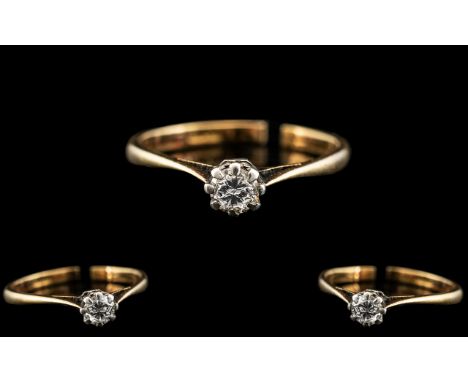 18ct Gold and Platinum Single Stone Diamond Ring. Marked 18ct and Platinum. .The Single Round Brilliant Cut Diamonds of Excel