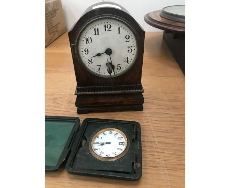 A travel clock; together with a mantel clock