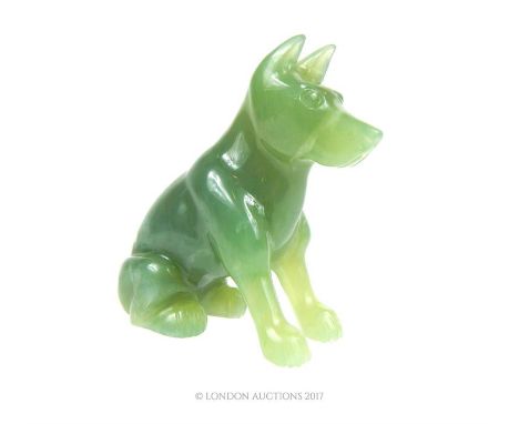 A 20th century, carved, green jade, dog figurine in excellent condition, 8 x 7 cm. 