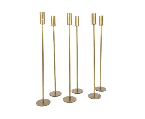 A set of six contemporary bronzed metal tea light holders, 81 x 13 x 13cm.