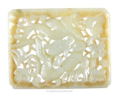 A Chinese, carved jade, rectangular, large, pendant/plaque depicting a dragon chasing the pearl of wisdom amongst flowers, 8 