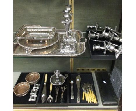 A mixed lot of electroplate, including:- a rectangular cake basket with swing handle, a rectangular tea tray, two pairs of fi