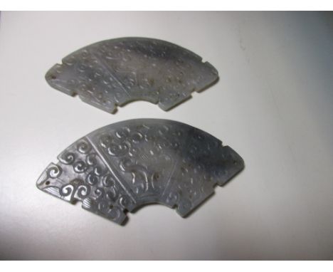 A matching pair of Chinese jade huang, 10.5cm (4 in) wide (2)  