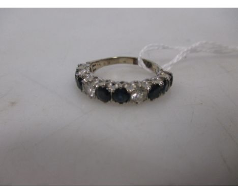 A sapphire and diamond half hoop ring, the ten stone round sapphire and diamonds all claw set in white metal to a pale yellow