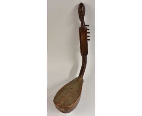 Tribal Art - an African Adungu-type string instrument, carved figural stem, hide covered sound box, 68cm long  Condition Repo