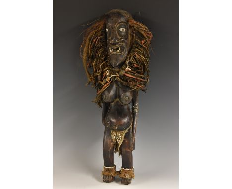 Tribal Art - an African fertility figure, she stands, adorned with fibres, wire and cowrie shells, 60cm high