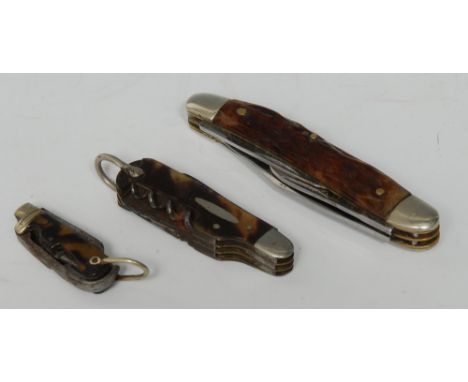 A 19th century tortoiseshell multi-tool pen knife, comprising two blades, a button hook and a corkscrew, 6.5cm long over loop