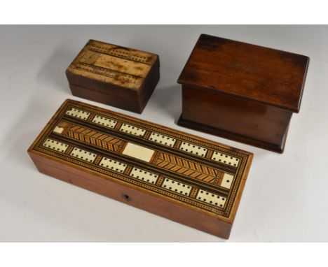 A 19th century mahogany and marquetry rectangular playing card box, the hinged cover inlaid for cribbage, enclosing compartme