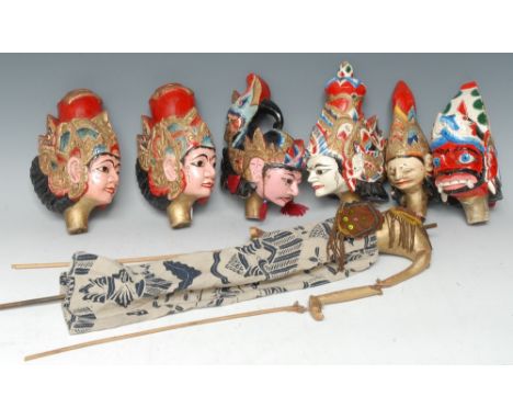 An Indonesian painted softwood wayang golek puppet, six interchangeable heads, the largest 22cm high 