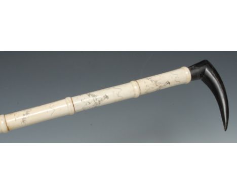 A Japanese bone walking stick, the sectional shaft engraved with a geisha, 91cm long 