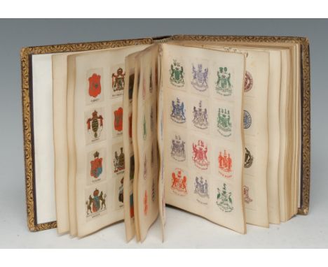 A Victorian collections of arms, crests, seals, monograms and pictograms, clipped from contemporary notepaper and stationery,