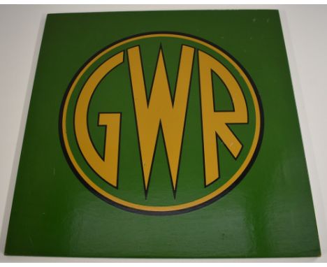 Railwayana - a 'coach panel' roundel with applied GWR (Great Western Railway) 1930s 'button' mnogram in gilt, on a green grou
