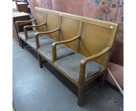 An oak waiting room bench