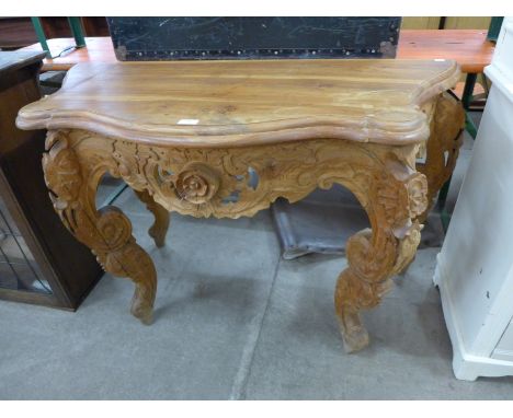 An Eastern carved hardwood console table