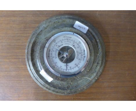 A serpentine aneroid barometer