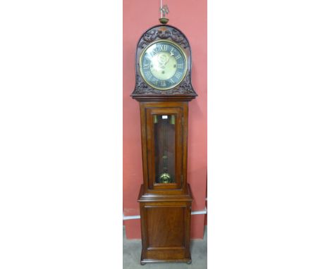 A Victorian mahogany longcase clock, having 12 inch brass dial with black chapter ring and Roman numerals, on three train wei