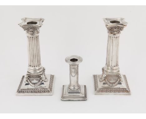 Edward VII pair of silver Corinthian column candlesticks, by Martin, Hall & Co., Chester, 1907, 17cm high, and another smalle