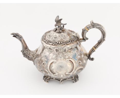 Victorian silver repousse teapot, with bird finial over a floral scroll design with engraved initial panel, bird head spout a