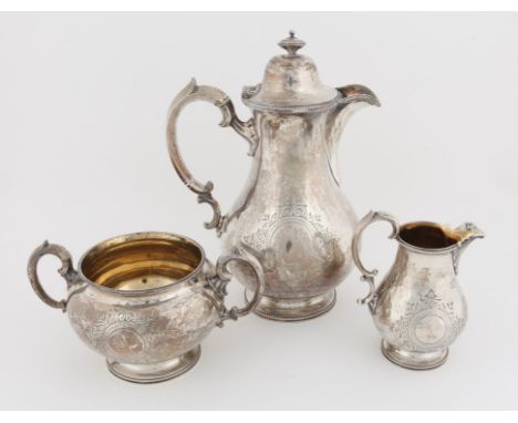 Victorian silver three piece part tea service, comprising hot-water jug, cream jug and sugar bowl, by Edward & John Barnard, 