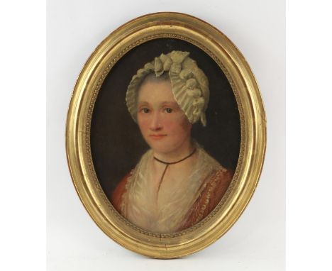 Nineteenth-century European School, oval portrait of a lady. Oil on canvas. Framed. Image size 46 x 37cm. 