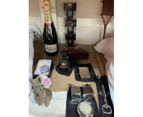 A limited edition bottle of Moet and Chandon champagne, together with a 10cl bottle of Innkeeper's tipple, a walnut box, Tom 