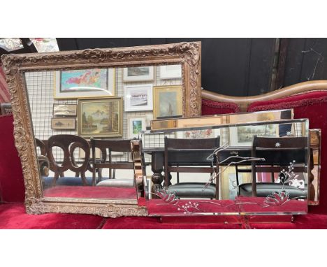 A wall mirror with leaping deer decoration together with a gilt framed wall mirror