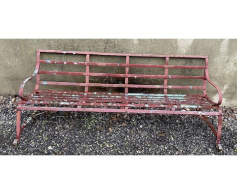 A slatted metal garden bench