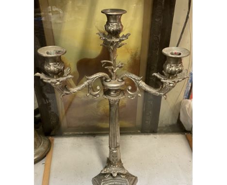 A large electroplated three branch candlestick on a trefoil base 