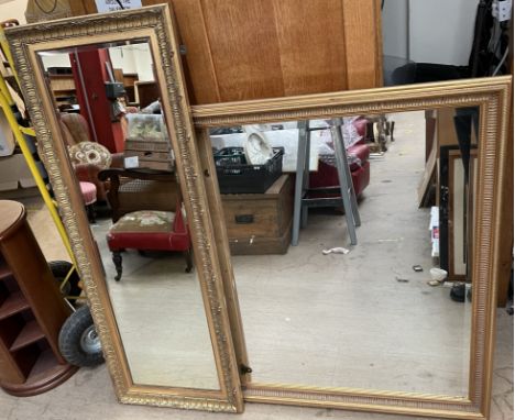 A large rectangular gilt wall mirror together with a tall gilt decorated wall mirror 