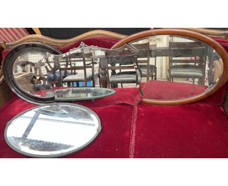 A Edwardian mahogany wall mirror together with three other mirrors 