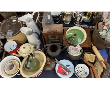 Enamel jugs, together with storage bins, teapot, clock, saucepans, bank notes etc 