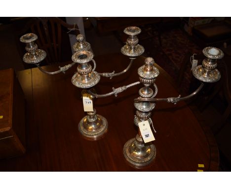 *A pair of 19th Century Sheffield plate candelabra.