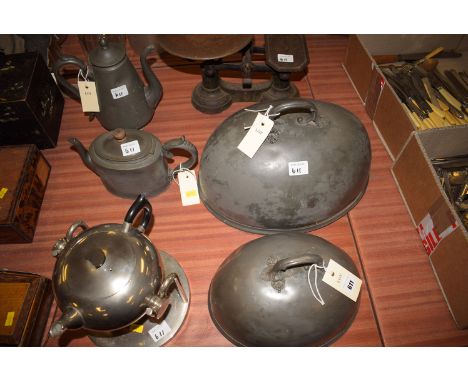 *Pewter ware, to include: a teapot and coffee pot; two meat dish covers; together with a stainless steel teapot on stand; and