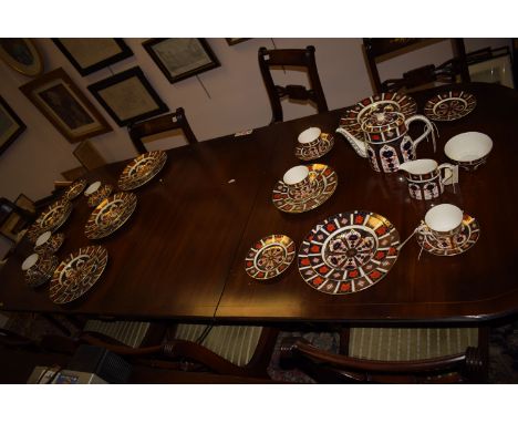 A Royal Crown Derby 'Old Imari' pattern dinner and tea service, approximately six place settings, comprising: dinner plates, 