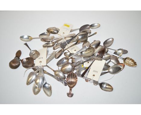 *A large collection of silver teaspoons; a mote spoon; metal tea caddy spoons; etc.