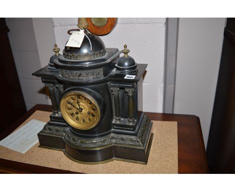 A Victorian slate temple form mantel clock, with gilt roman dial.