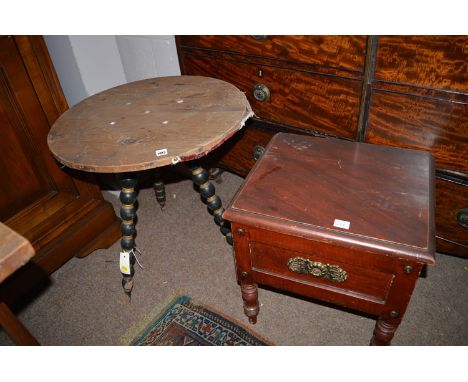 *A pine top table, raised on three turned bobbin legs; together with a painted commode with handles to sides and brass mounts