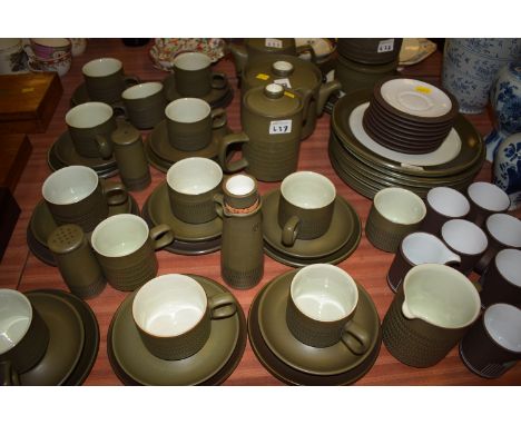 A Denby part dinner and tea service, in olive green glaze, to include: teapot, hot water jug, tea cups and saucers, salt and 