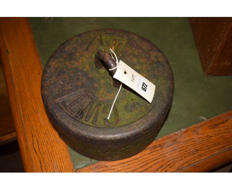 A circular cast iron 1/2 CWT, with loop handle and pressed military arrow mark.