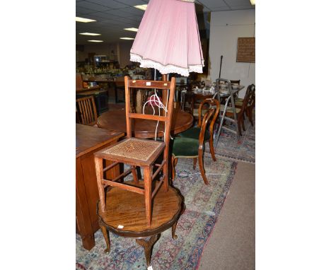 A circular mahogany coffee table; a mahogany standard lamp and shade; and an inlaid bedroom occasional chair.