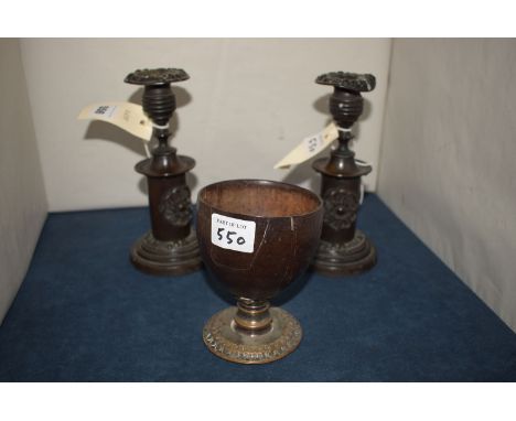 *A pair of 19th Century bronze candlesticks (one severely damaged); together with a coconut goblet with plated base.  (3)