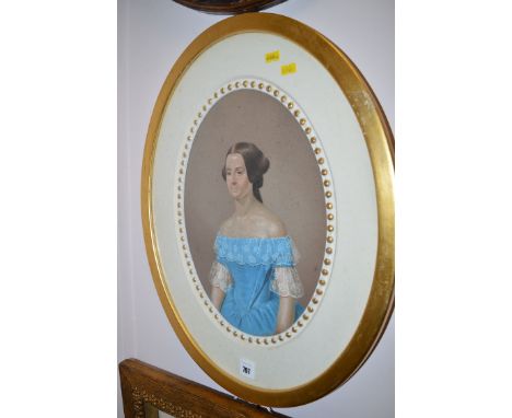 A 19th Century pastel portrait of a young woman wearing a blue lace-trimmed dress, in oval frame.