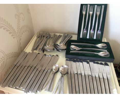 A high-quality set of stainless steel cutlery from Viners of Sheffield, featuring the elegant "Studio" pattern. Designed with