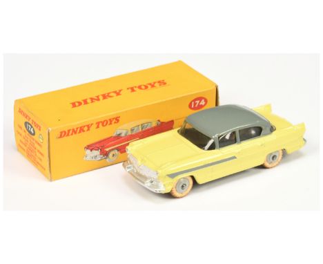 Dinky 174 Hudson Hornet Sedan - yellow body with mid grey roof & side stripes, light grey ridged hubs with white treaded tyre