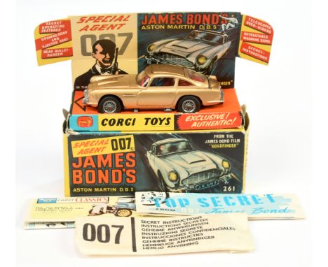 Corgi 261 James Bond's Aston Martin D.B.5 taken from the film "Goldfinger" - finished in gold body, red interior with "James 