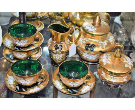 Glassware - a Murano emerald glass tea set, heavily gilded and painted, including teapot, cups and saucers, milk jug, sucrier