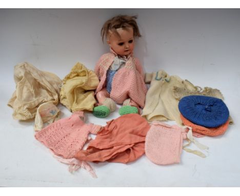 An early 20th century Heubach Koppelsdorf bisque head socket doll, sleeping blue eyes, open mouth, light brown wig, bent limb
