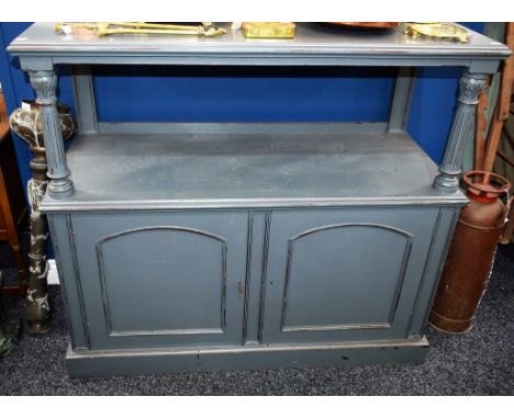 A Victorian painted buffet sideboard, the upper moulded rectangular tier with arched half-gallery centrally applied with a sw