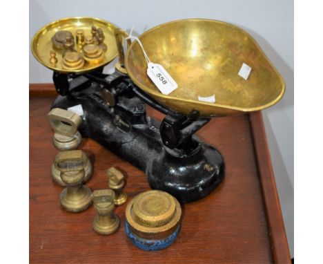 A set of cast and brass kitchen balance scales