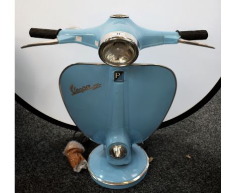 A novelty table lamp, modelled as a Vespa handlebar and front panel, 63cm high